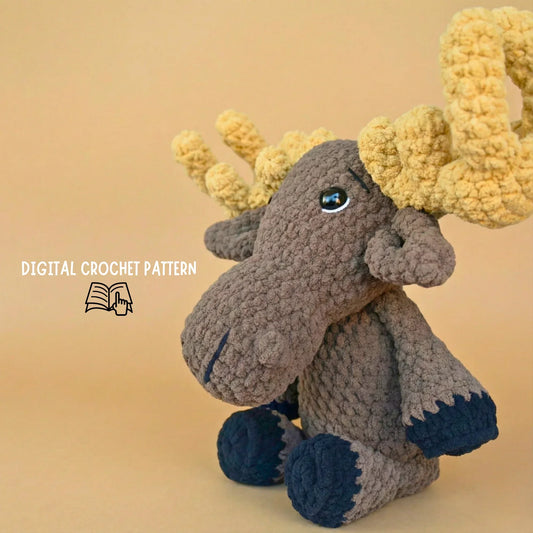 Plush crochet moose amigurumi with large antlers, digital crochet pattern on tan background