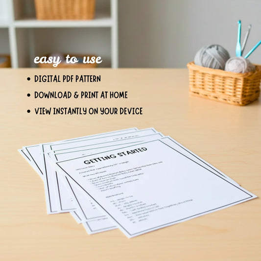 Printable crochet pattern instructions on a desk with yarn and hooks in a basket nearby.