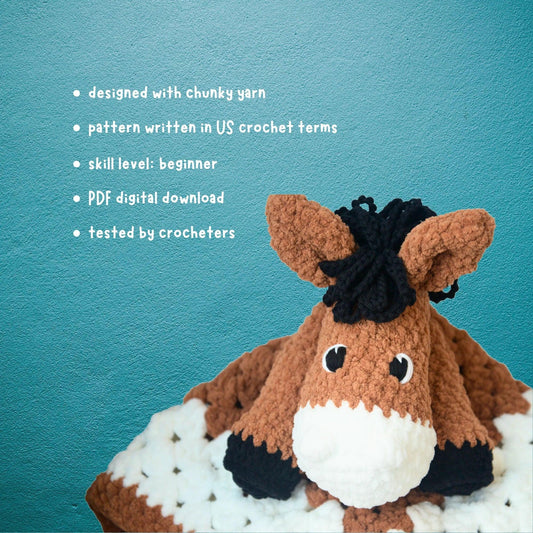 Crochet horse plushie pattern for beginners, made with chunky yarn, on blue background.