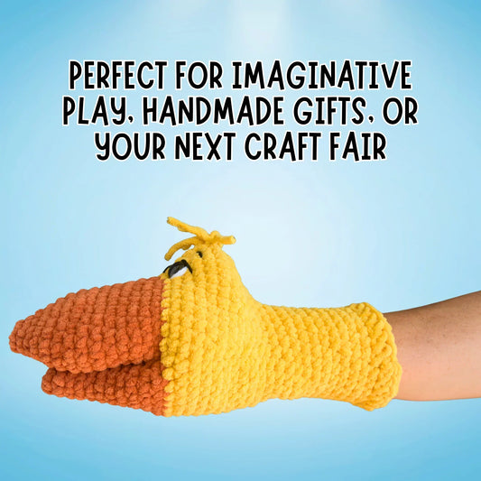 Yellow and orange crochet duck hand puppet on an arm with blue background