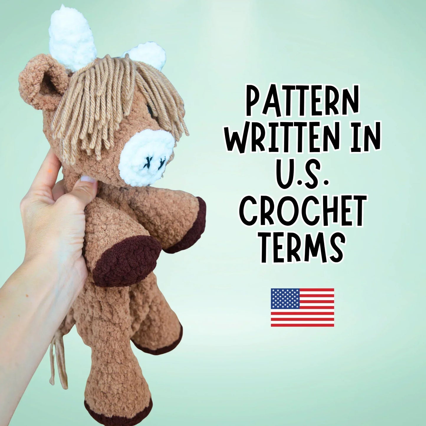 Hand holding a crocheted highland cow plushie, amigurumi pattern text, US flag icon