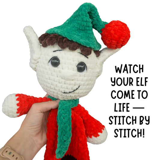 Hand holding crochet elf plushie with green hat, red outfit, and scarf, amigurumi pattern