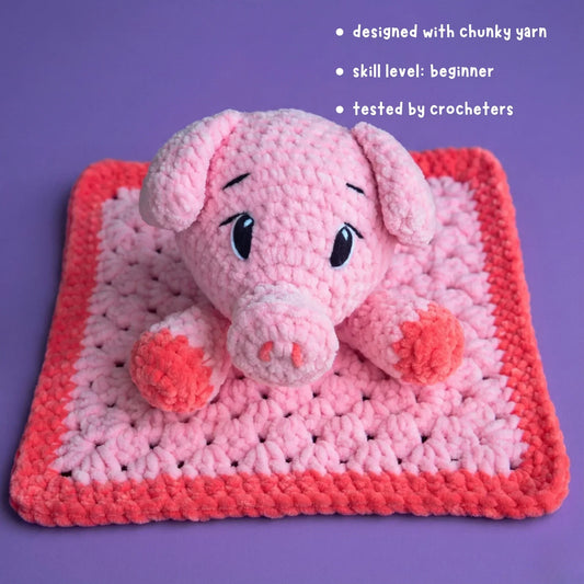 Beginner-friendly pink chunky yarn crochet pig lovey on purple background