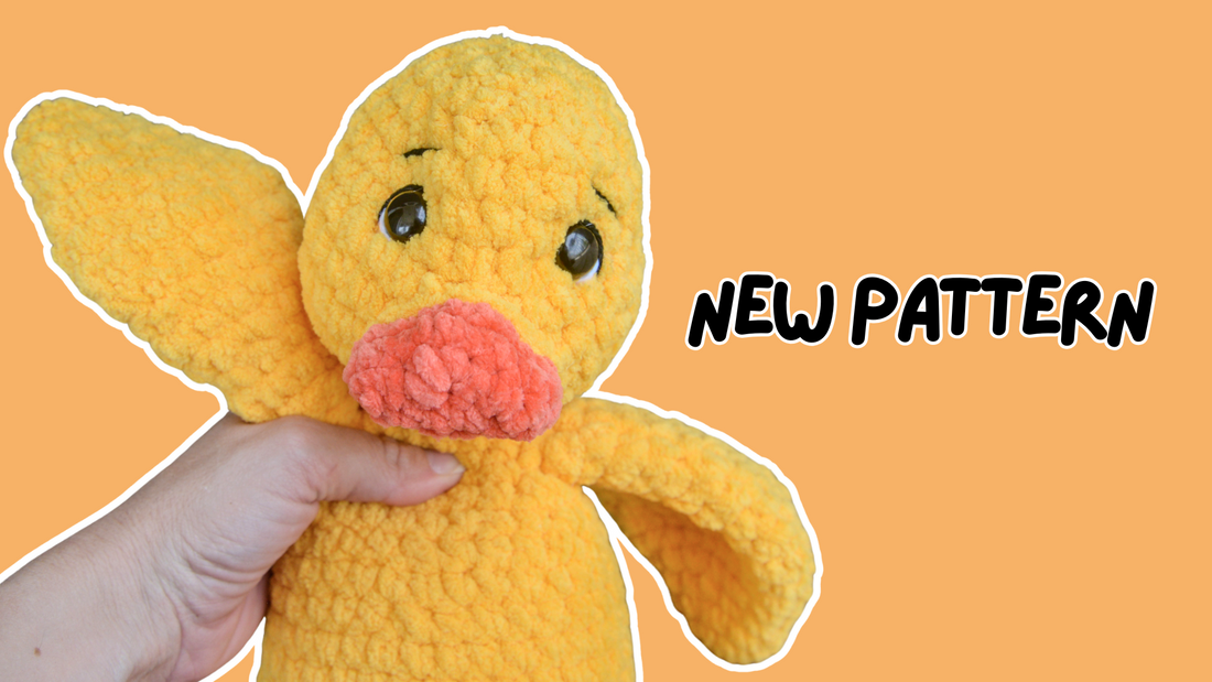Hand holding a yellow crocheted duck plush toy with text 'New Pattern' on orange background
