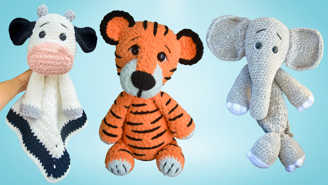 Handmade crochet plush toys including a cow lovey blanket, a tiger stuffed animal, and an elephant stuffed doll