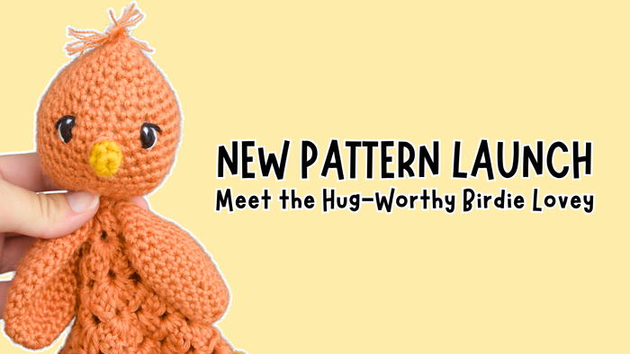 Hand holding orange crocheted bird amigurumi on yellow background with new pattern launch text