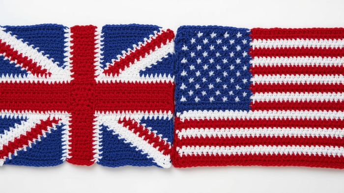Crochet UK and US flag patterns in red, white, and blue yarn side by side on white background