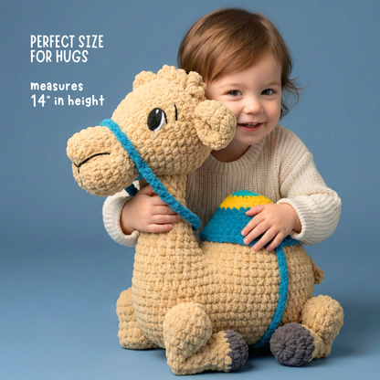 Toddler hugging a 14-inch tall plush camel toy with textured fur and blue saddle