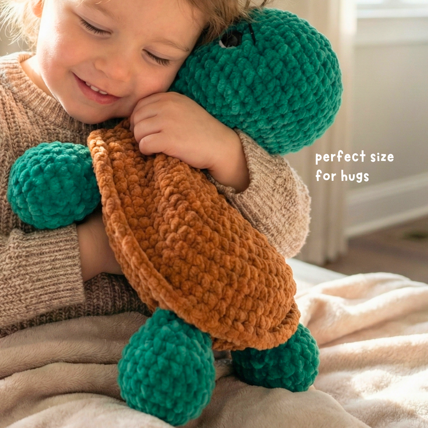 Child hugging a soft, crocheted green and brown turtle plush toy in cozy indoor setting