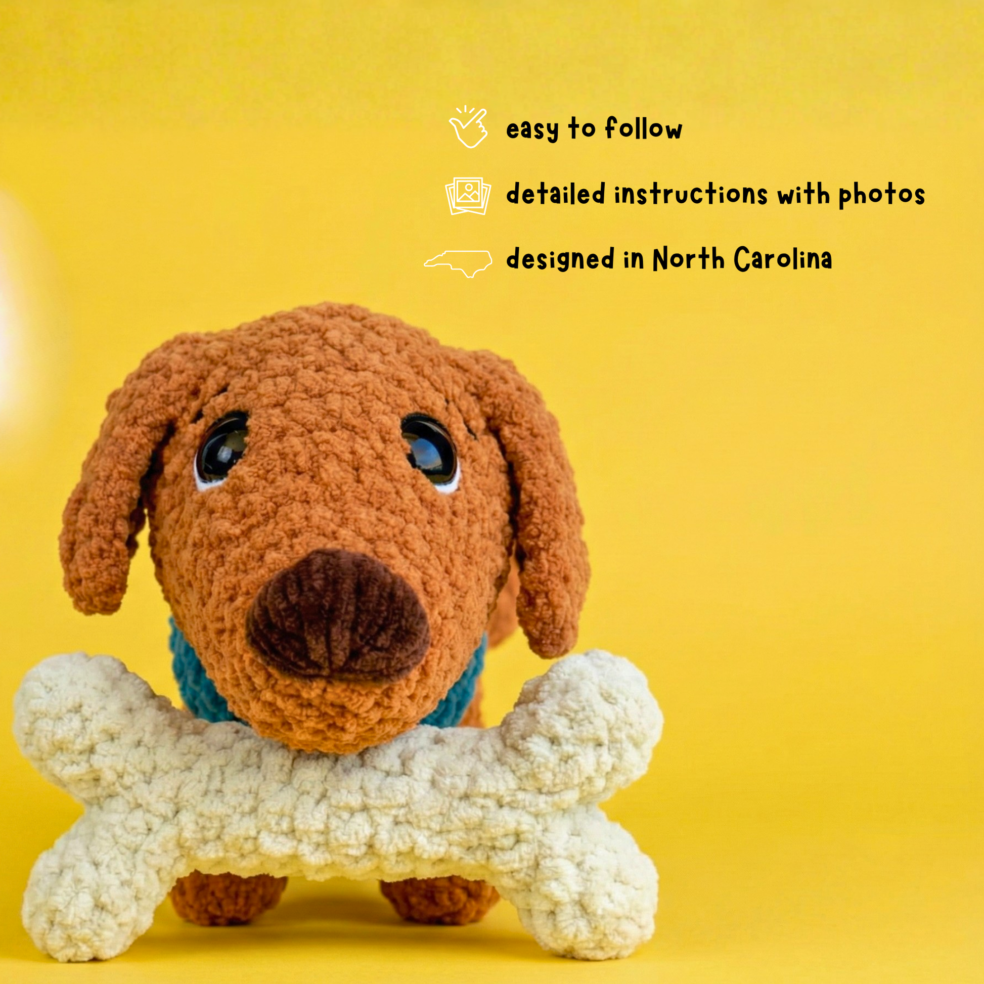 Brown crocheted dog holding white bone toy on yellow background with North Carolina design text