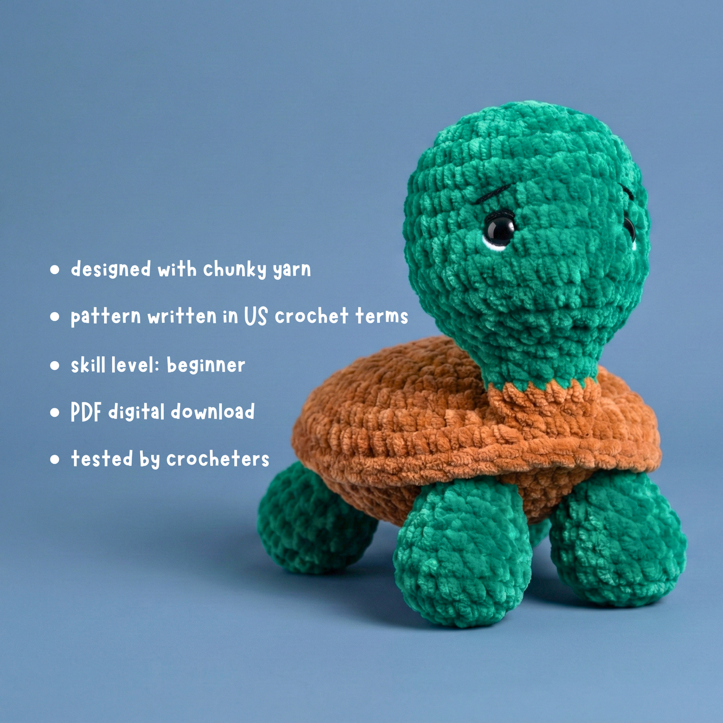 Chunky yarn crocheted green turtle with brown shell on blue background, beginner pattern details