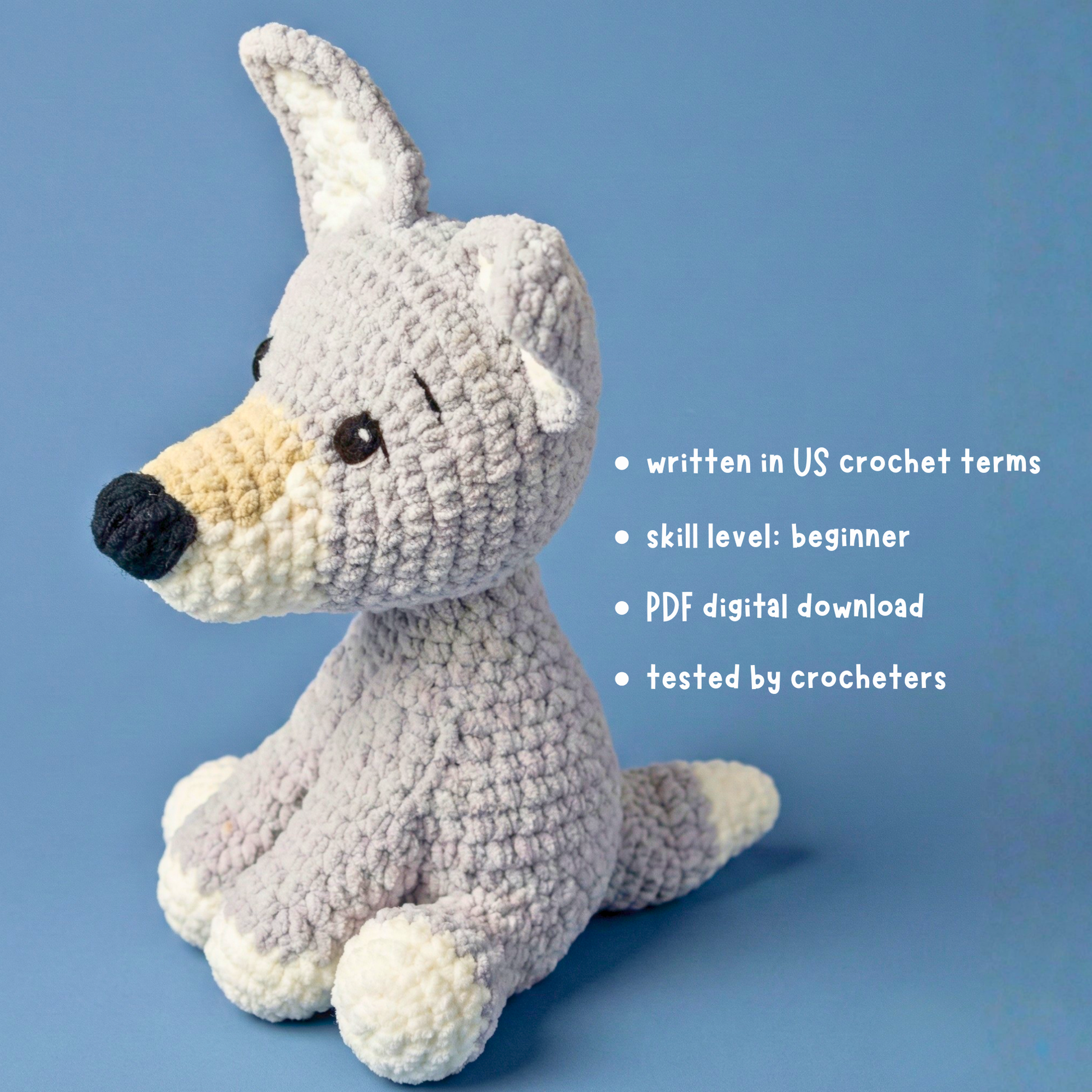 Gray and cream crocheted dog plush toy on blue background with crochet pattern details text