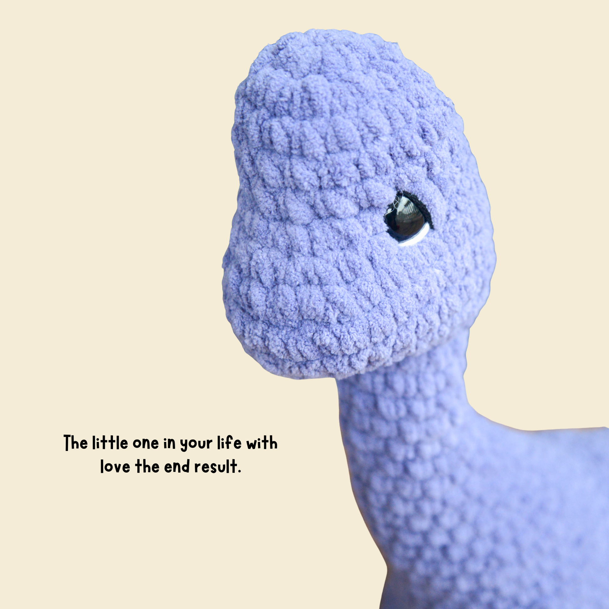Close-up of a textured blue plush toy with a neutral background and text.