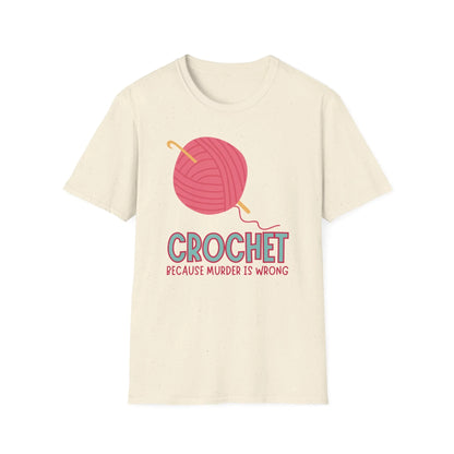 Beige t-shirt with a pink yarn ball and crochet hook graphic and text on a white background