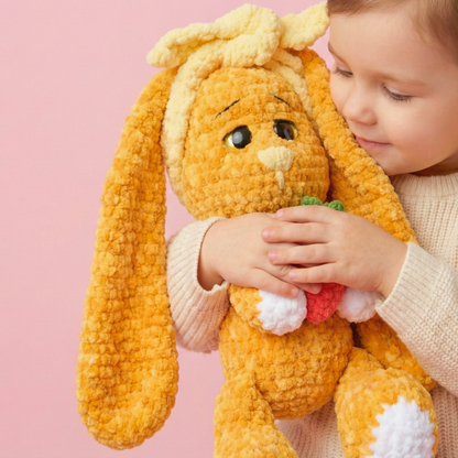 Child holding a plush toy with a pink background