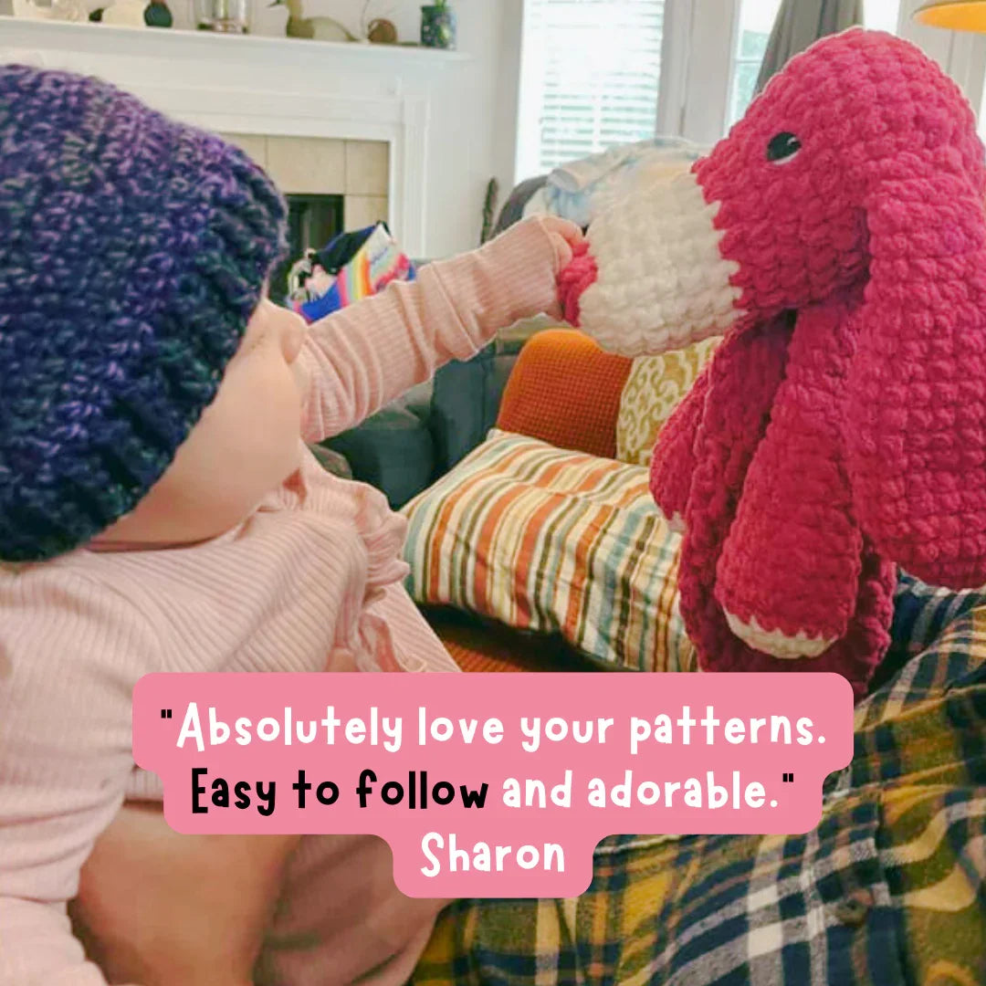 Baby wearing a purple hat touching a pink crochet dog plushie, with review text overlay.