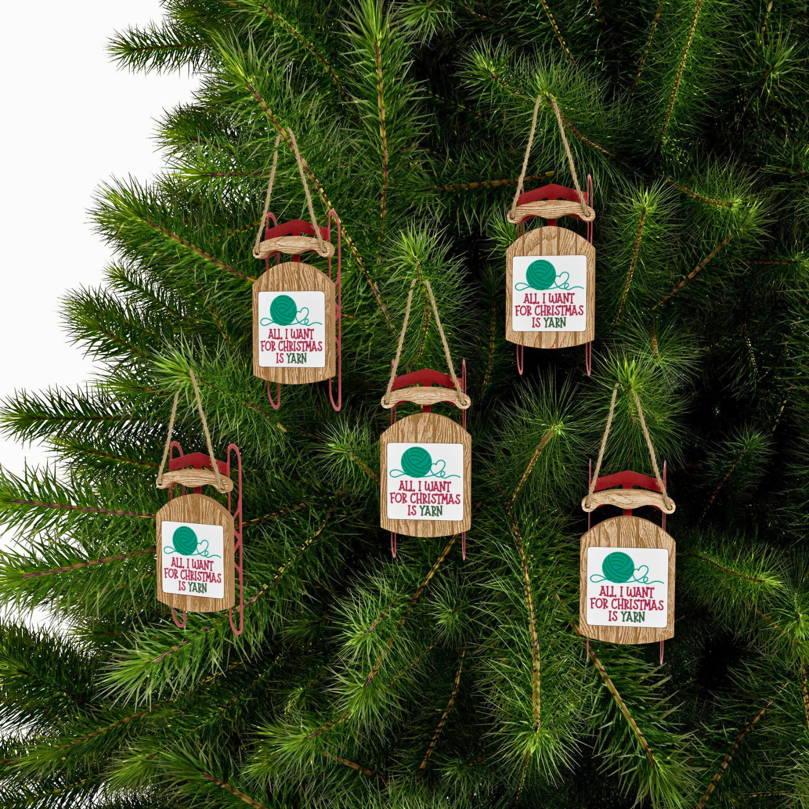 Wooden Christmas ornaments with humorous sayings on a tree