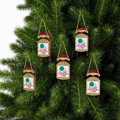 Wooden Christmas ornaments with humorous sayings on a tree