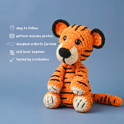 Crocheted tiger toy on a blue background with text about the crochet pattern.