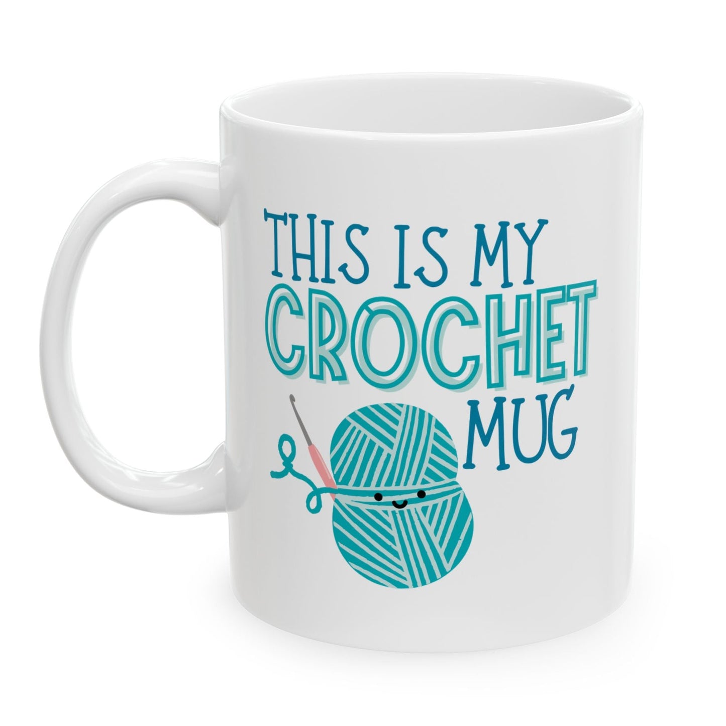 White mug with teal text and yarn ball design on a white background