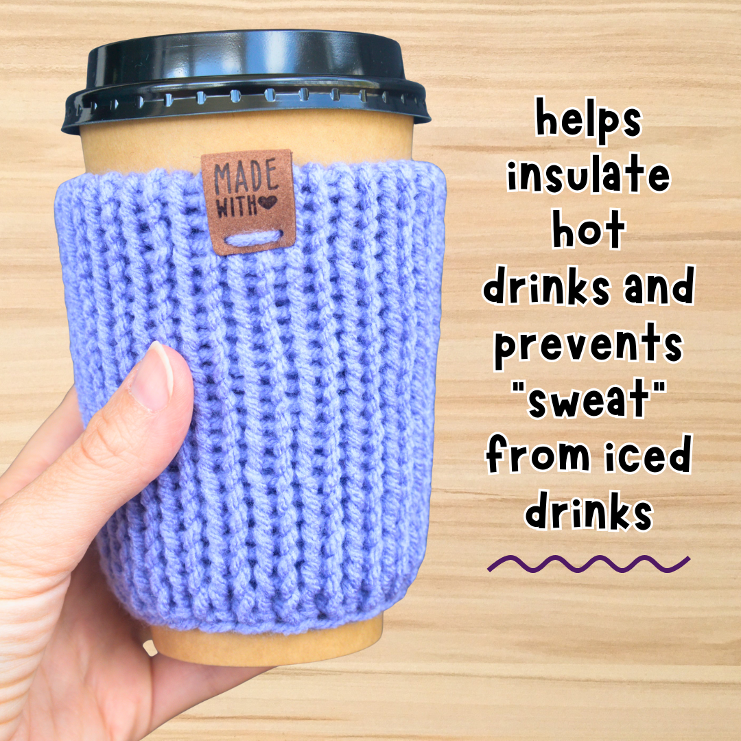 Hand holding a coffee cup with a blue sleeve on a wooden surface, text about insulation properties.