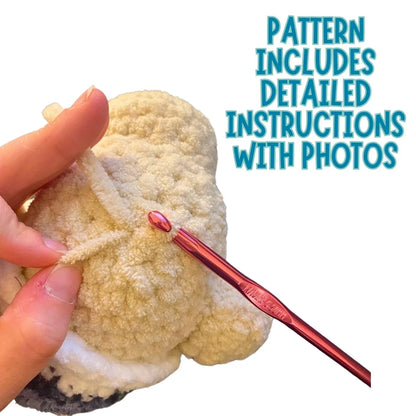 Hand crocheting a plush sleeping bear with a red crochet hook and soft yarn