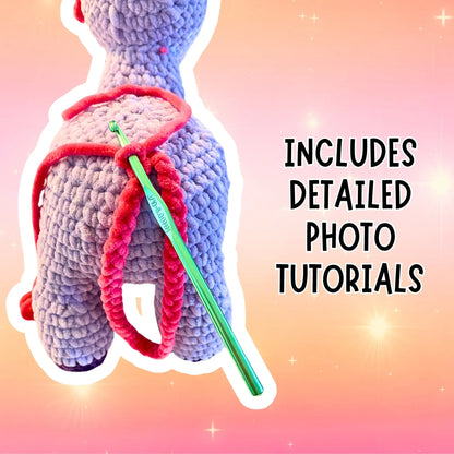 Crochet unicorn plushie pattern with pink yarn tail and green crochet hook