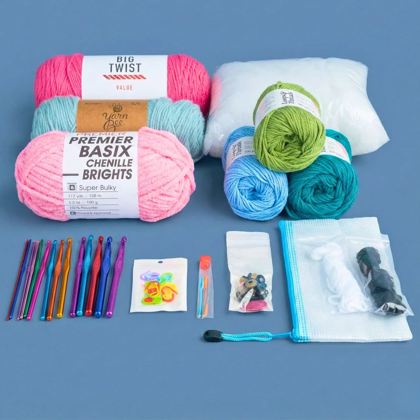 Beginner crochet kit with colorful yarn skeins, hooks, safety eyes, stuffing, and accessories