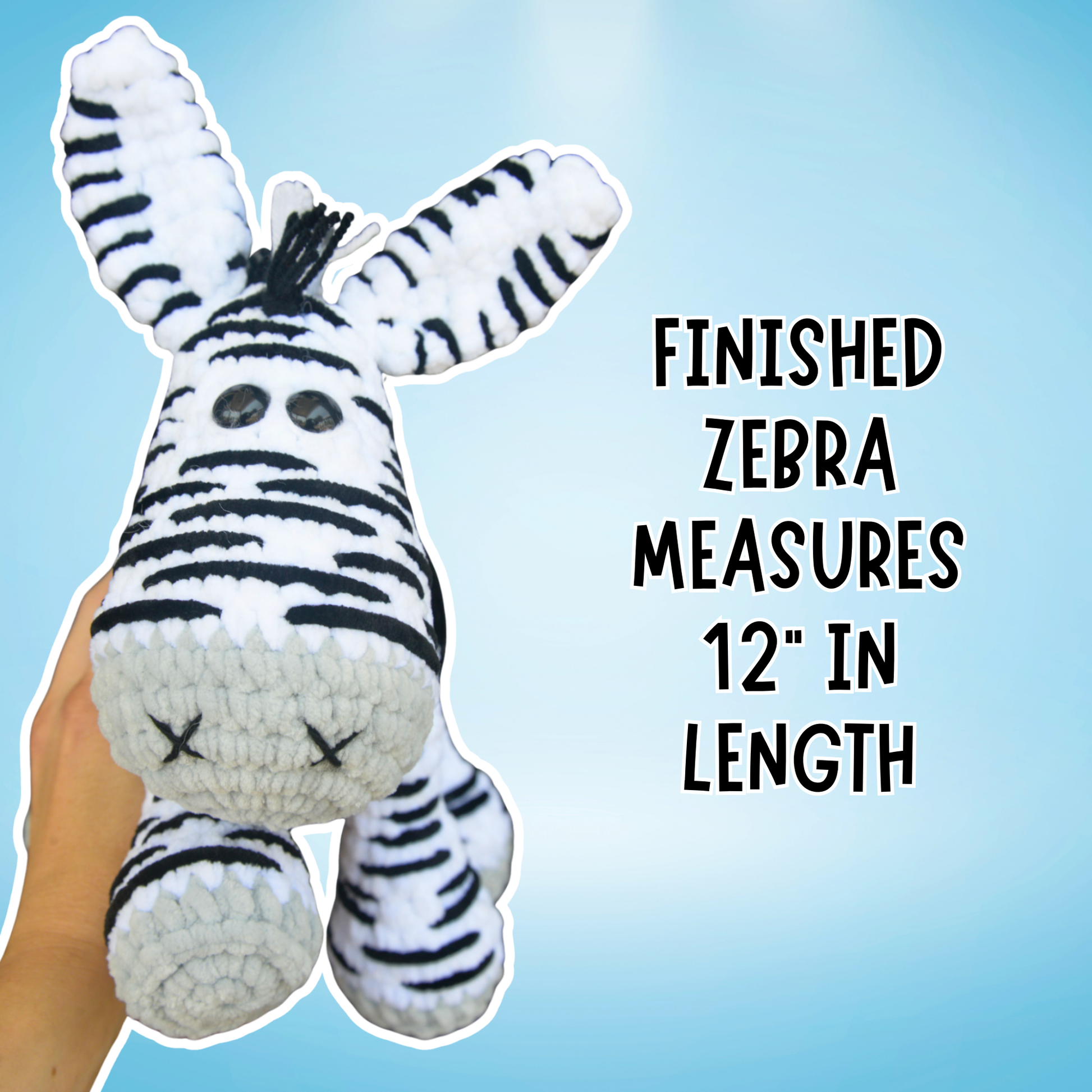 Handmade zebra plush toy held by a hand with text indicating its length on a blue background