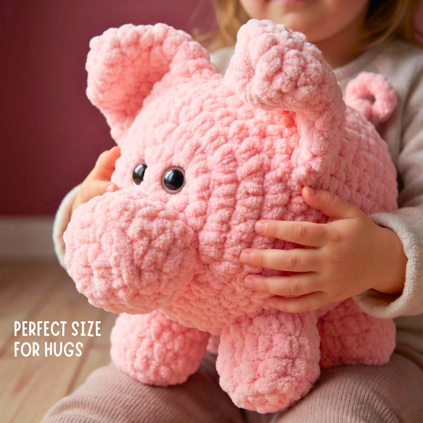 Child holding a soft pink crochet plush pig toy with large eyes, perfect size for hugs
