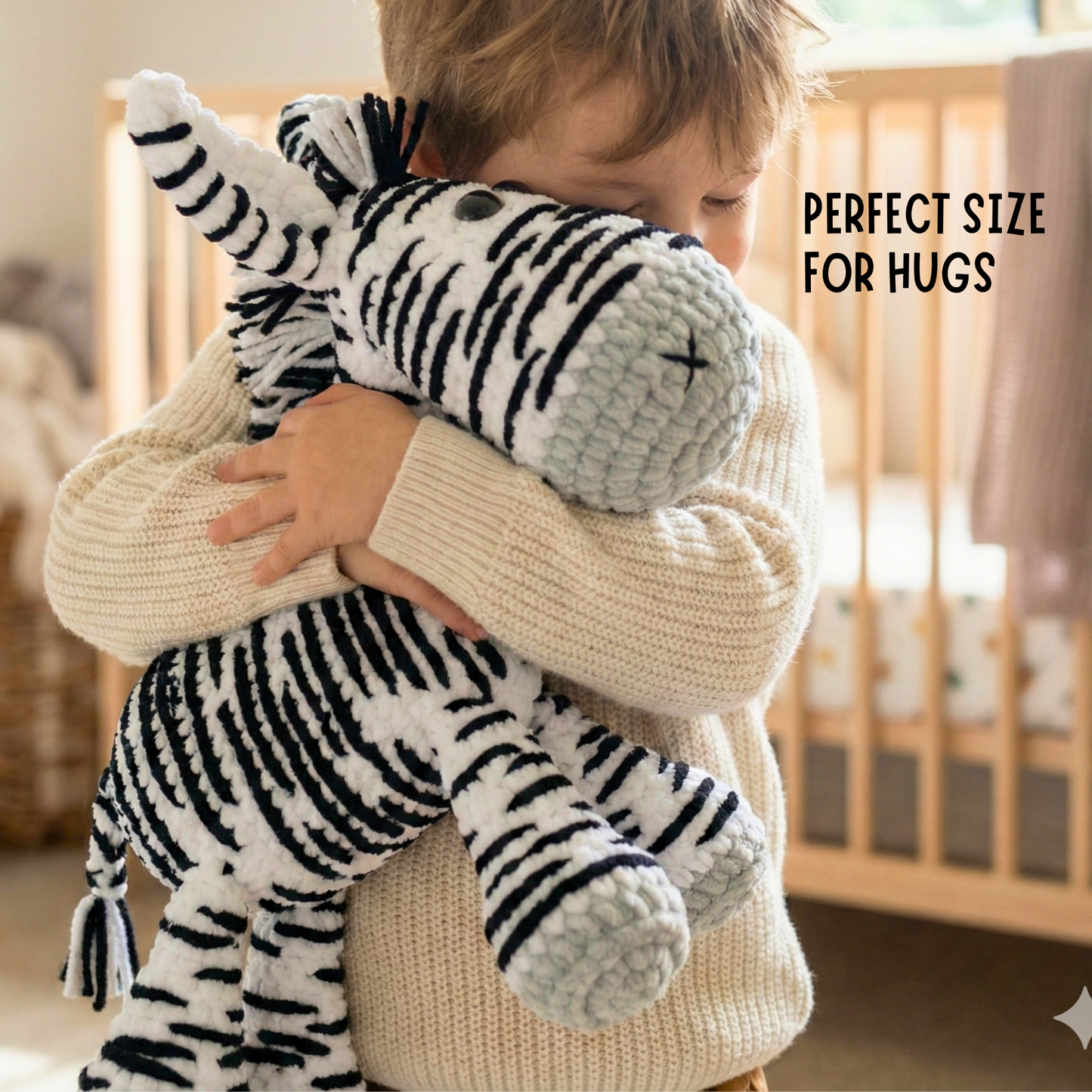Child hugging a handmade crochet zebra plush toy in a cozy nursery setting