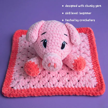 Beginner-friendly pink chunky yarn crochet pig lovey on purple background